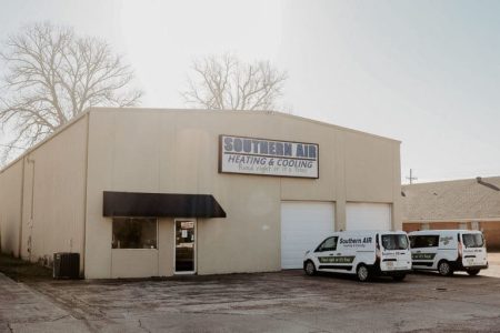 Southern Air Heating & Cooling commercial building with service vehicles parked outside in Monroe, Louisiana.